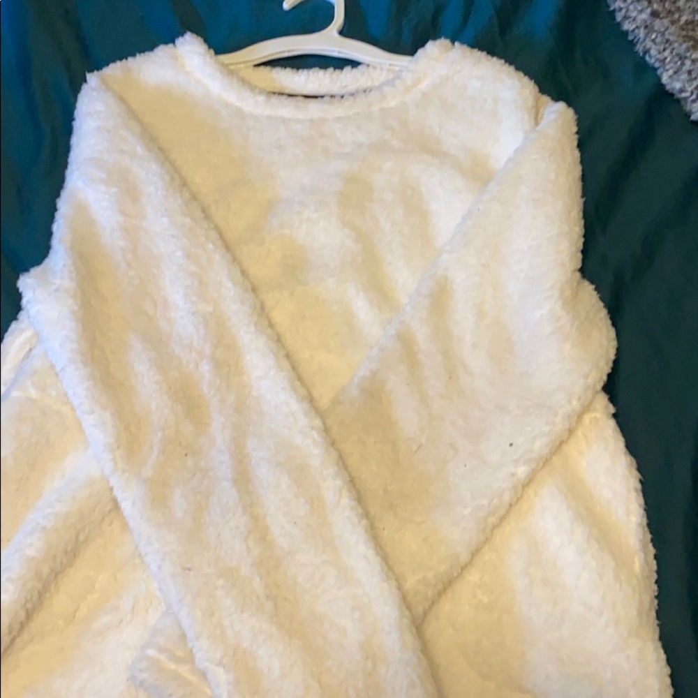 a fluffy white sweater.